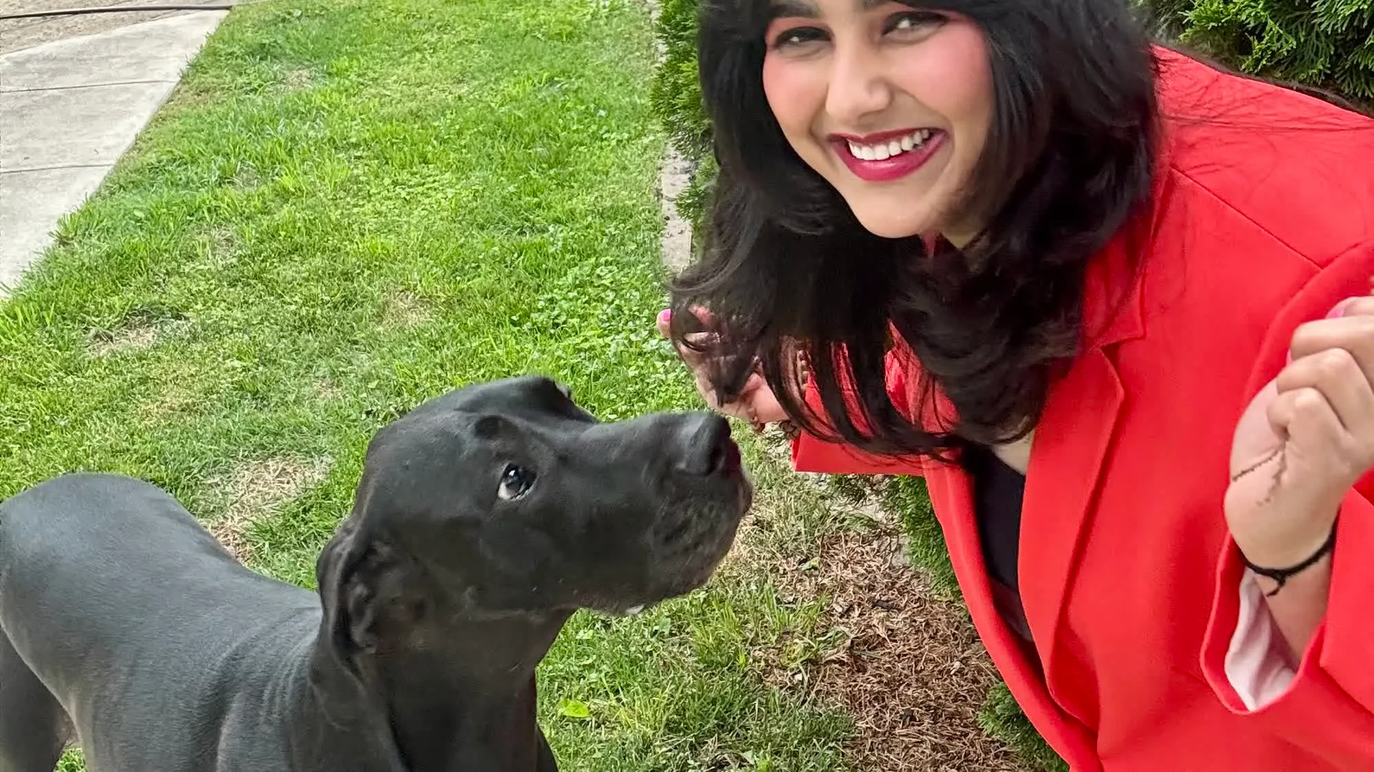 Pooja Bery outdoors with her dog