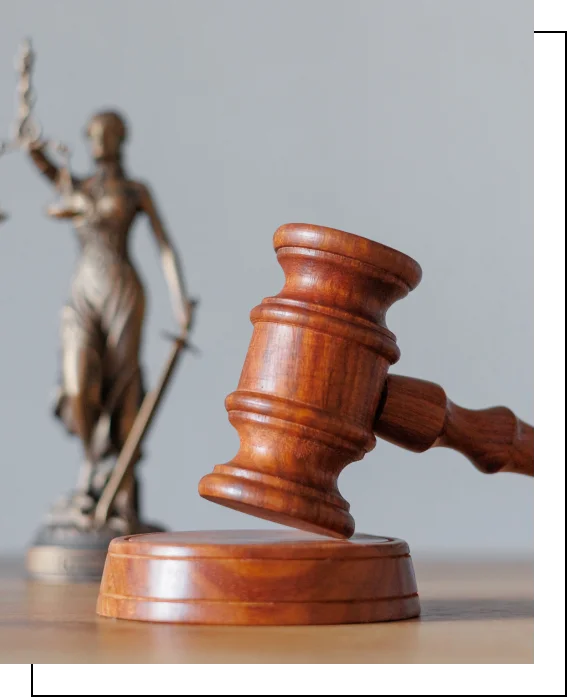 Judge's gavel and Lady Justice statue symbolizing fairness and legal authority