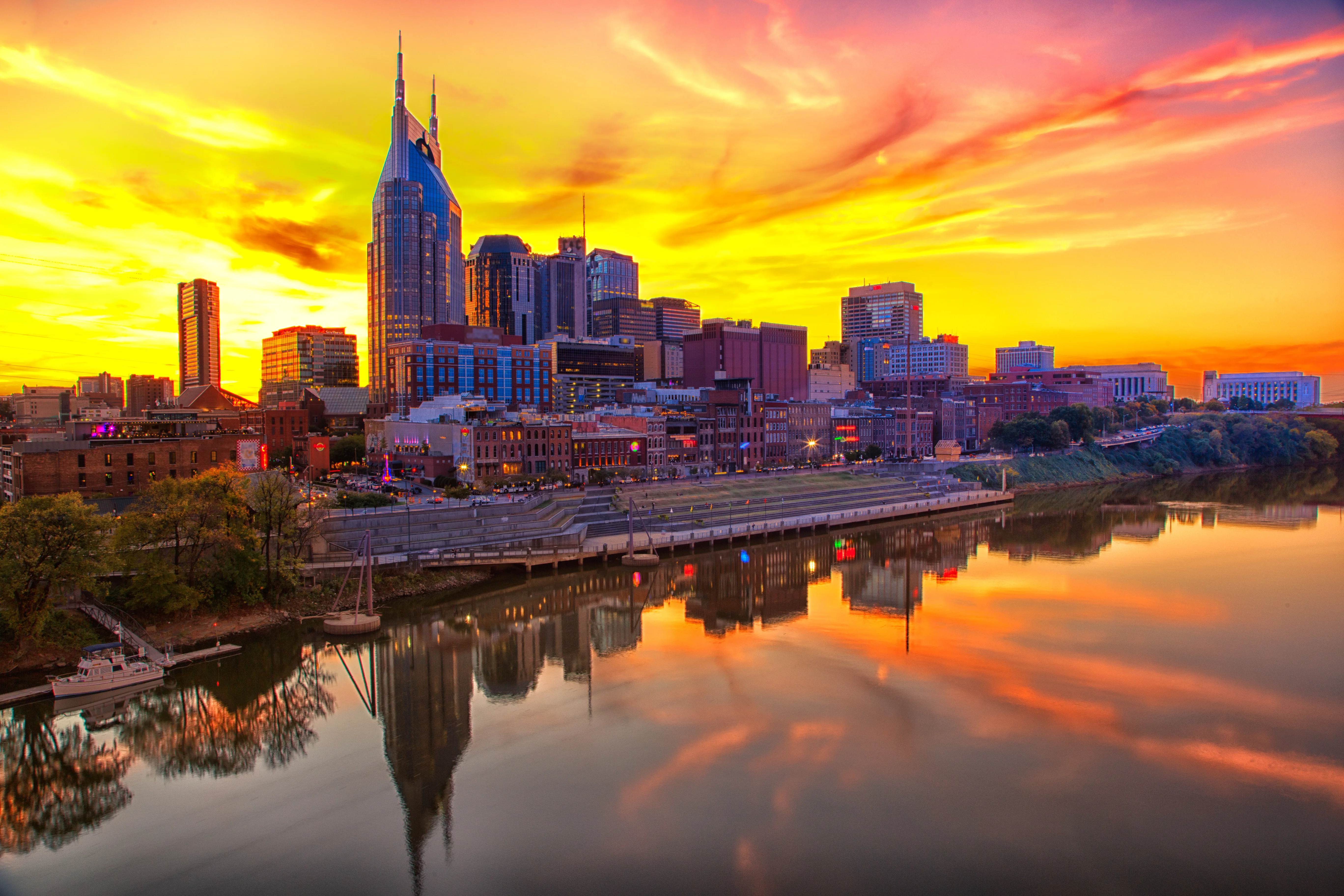 Nashville skyline at sunset reflecting on the river, representing Bery Law in Tennessee